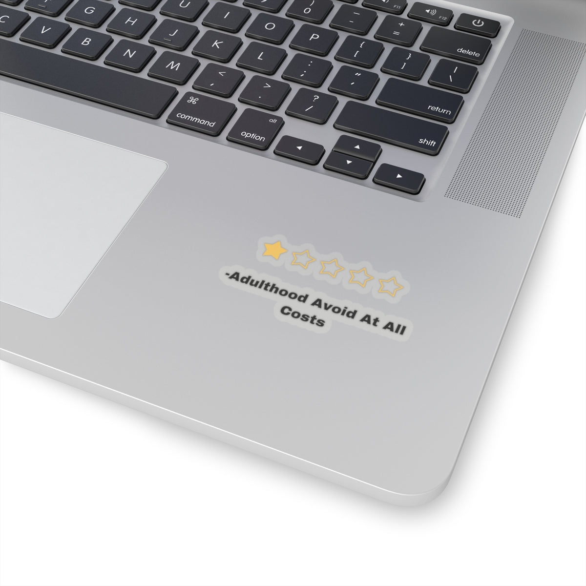 Adulthood review sticker with one star rating and text Avoid At All Costs on laptop surface