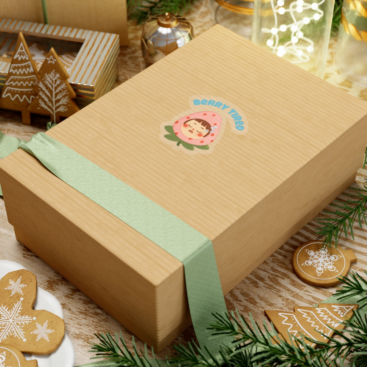 Berry tired vinyl sticker on a brown gift box with green ribbon surrounded by holiday decorations