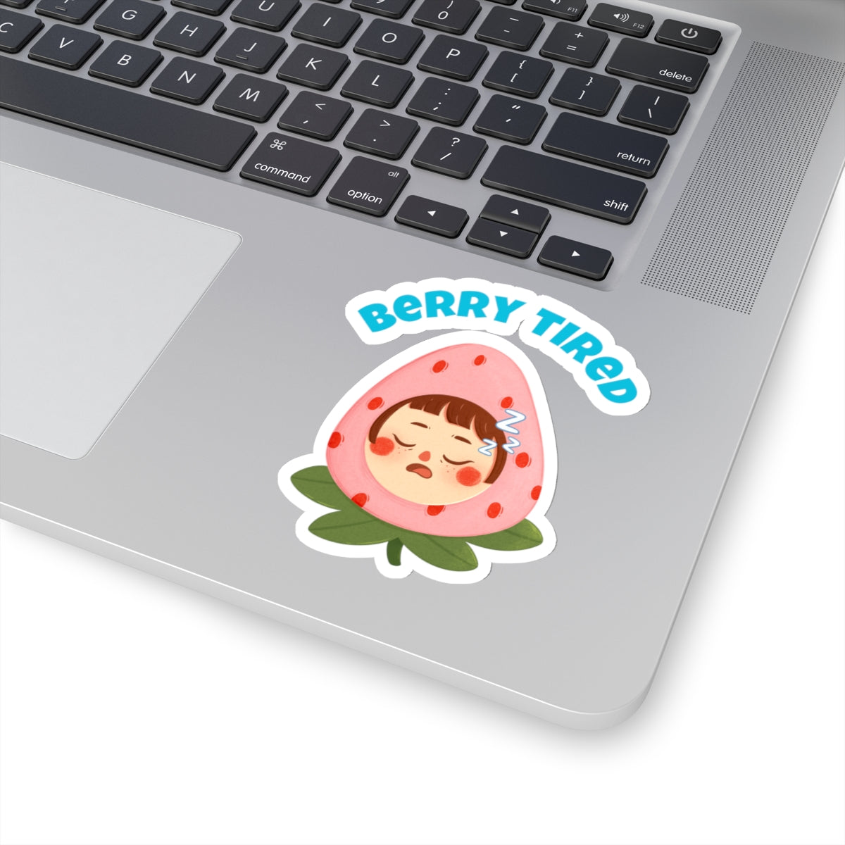Berry tired vinyl sticker featuring a sleepy face inside a strawberry on a laptop surface