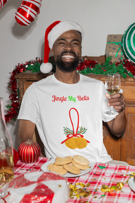 Man in Santa hat wearing Printify naughty holiday shirt for adults white T shirt with Jingle My Bells bell design and cookies