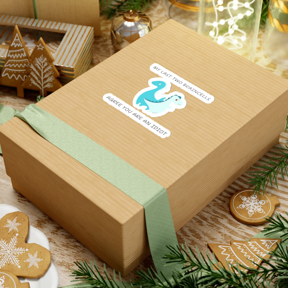 Gift box with cute dinosaur meme stickers by Printify on brown paper packaging with green ribbon