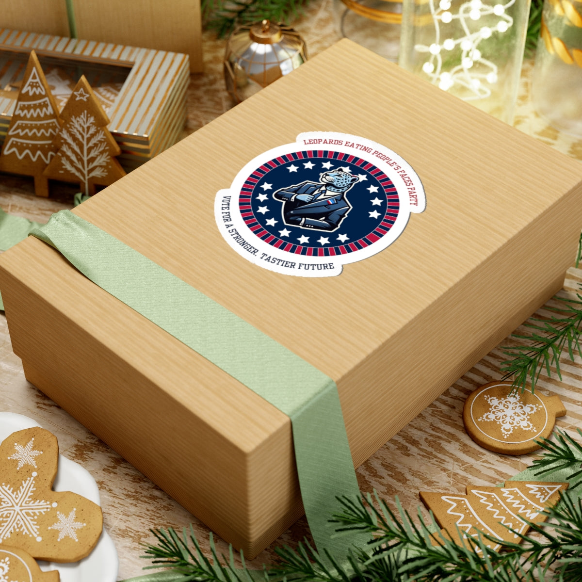 Funny political leopard face eating party sticker on a wrapped gift box with holiday decorations