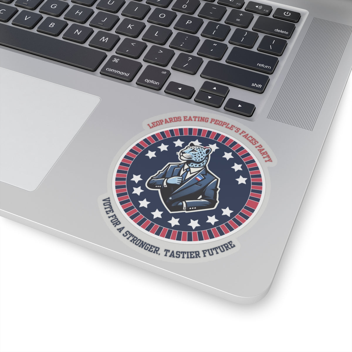 Funny political leopard face eating party sticker on laptop with patriotic red white and blue design