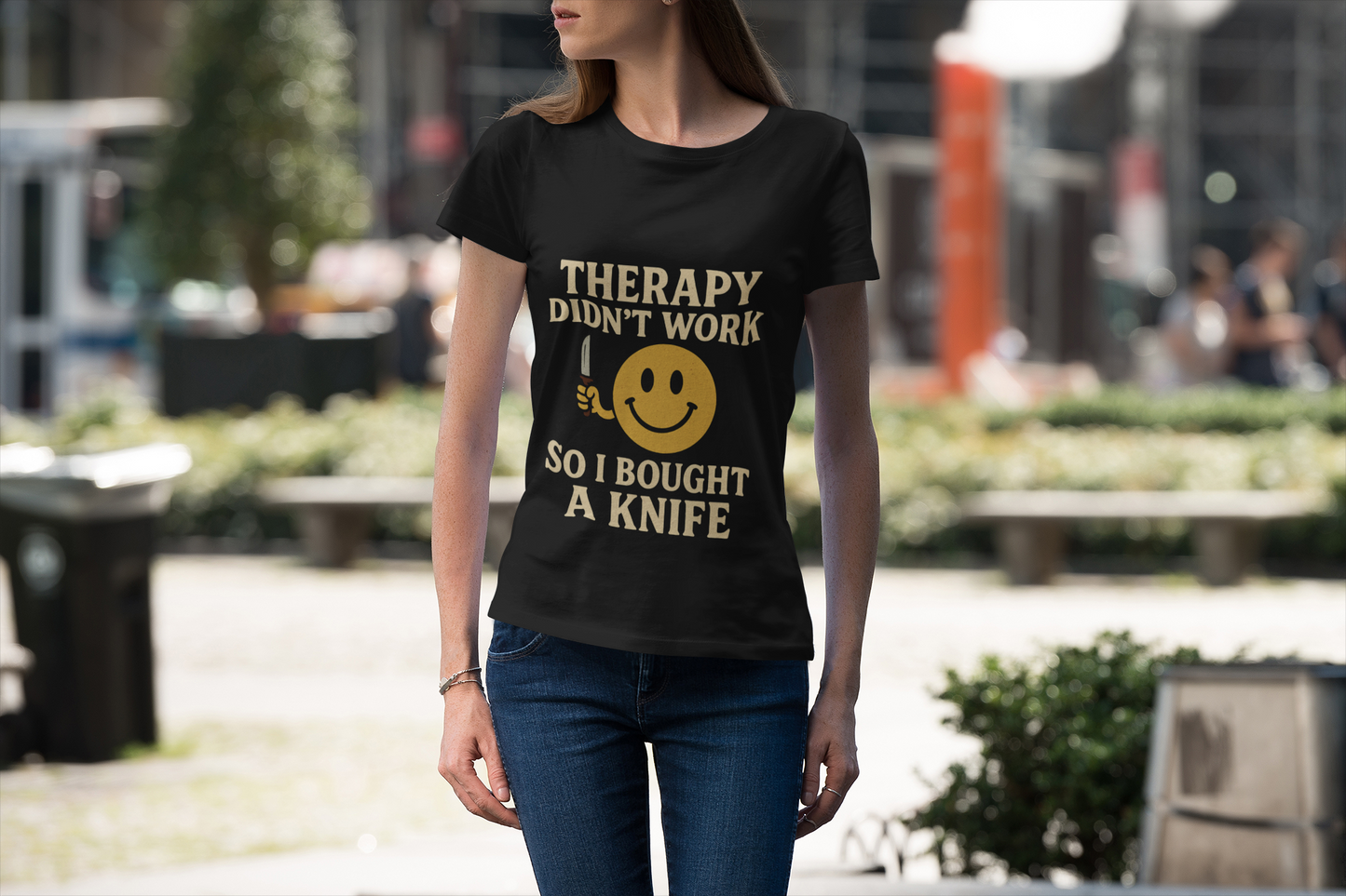 Woman modeling Printify black tee with smiley knife slogan therapy dark joke humor unisex t shirt .