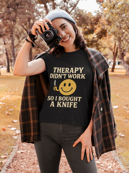 Woman outdoors wearing black tee with bold Therapy didnt work so I bought a knife print therapy dark joke humor unisex t shirt .
