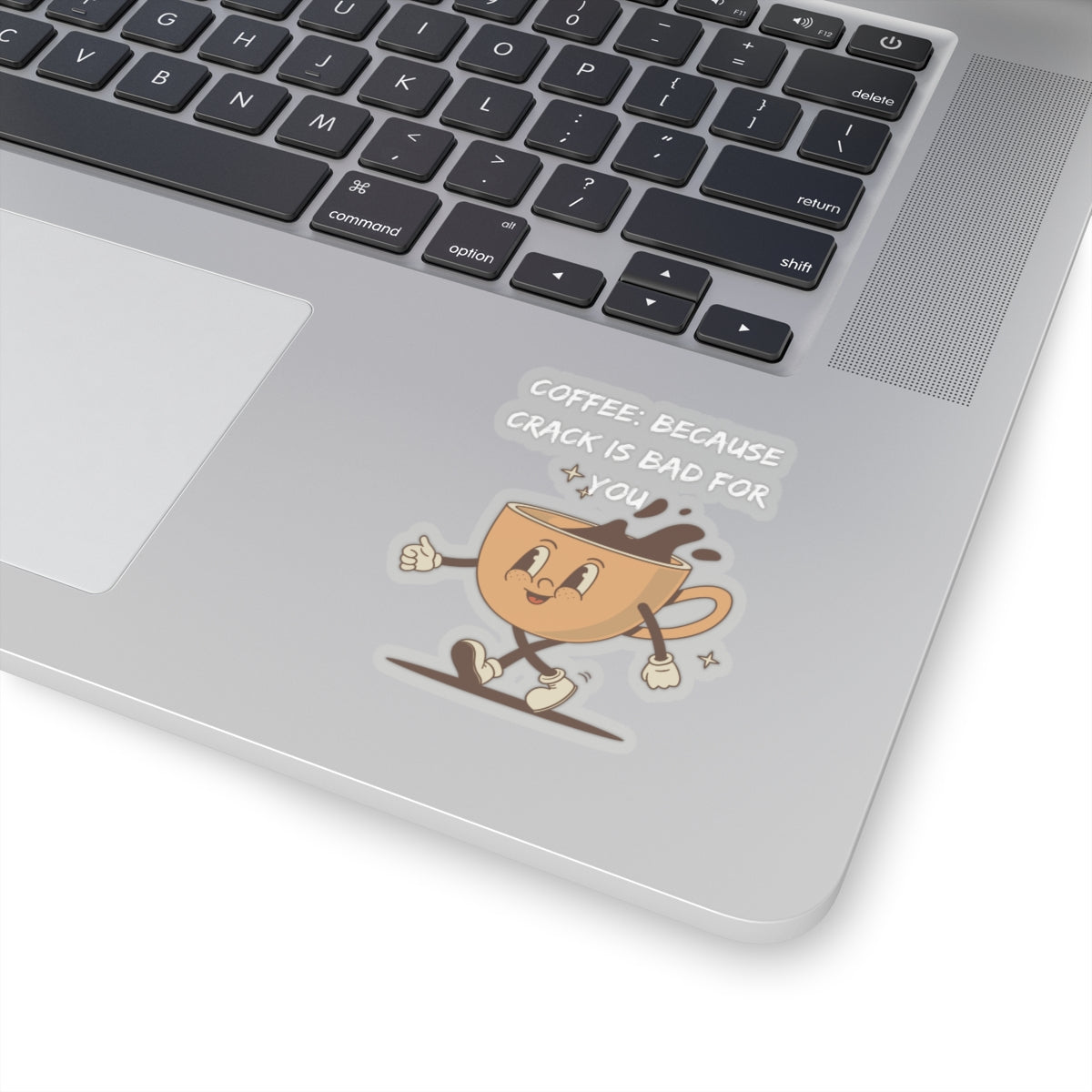 Humor kiss-cut sticker of a smiling coffee cup with phrase on silver laptop corner