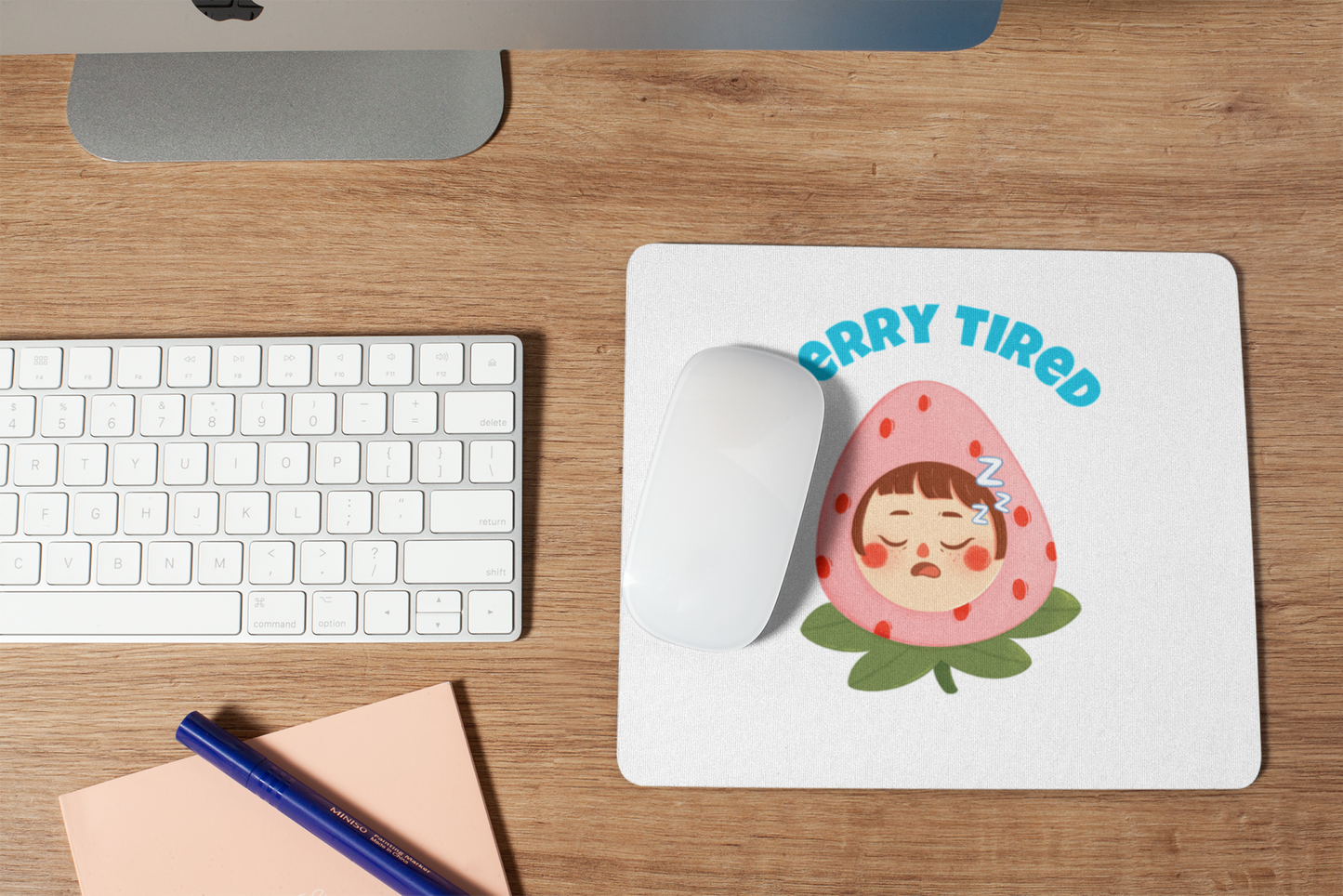 Printify cute cartoon pun berry tired mouse pad featuring sleeping strawberry character on white desk
