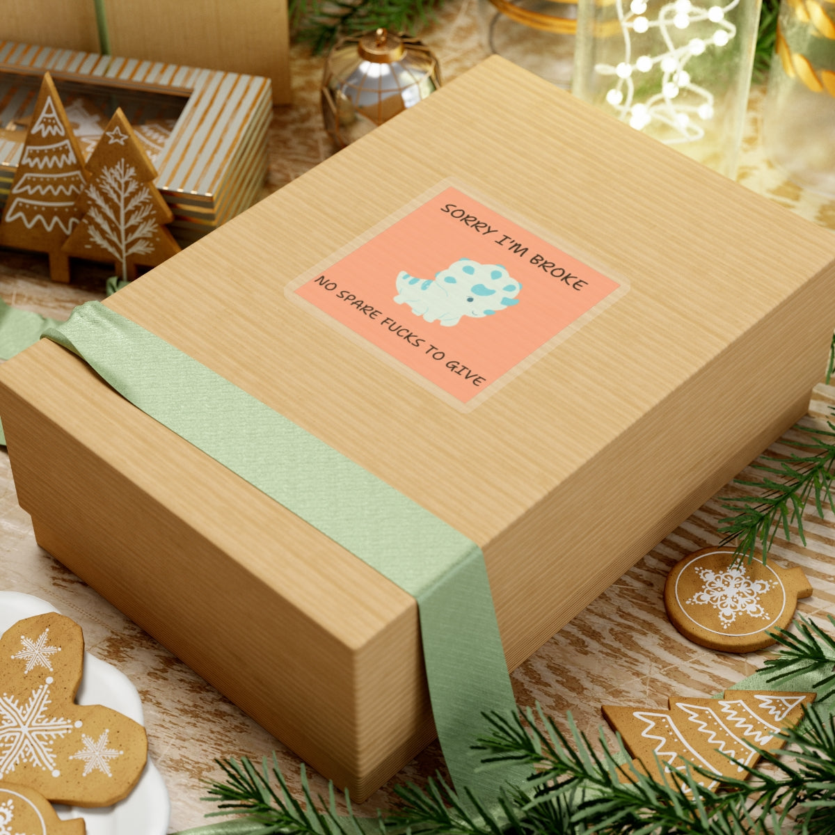 No fucks to give funny dino sticker on a brown gift box with green ribbon and holiday decorations