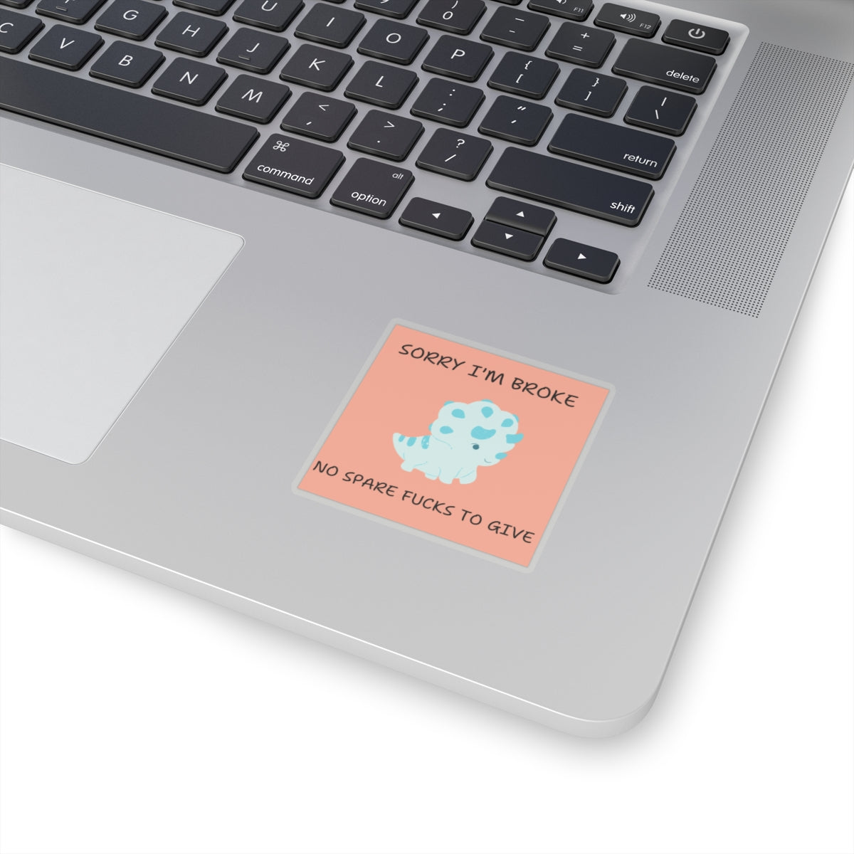 No fucks to give funny dino sticker with blue dinosaur and humorous text on laptop