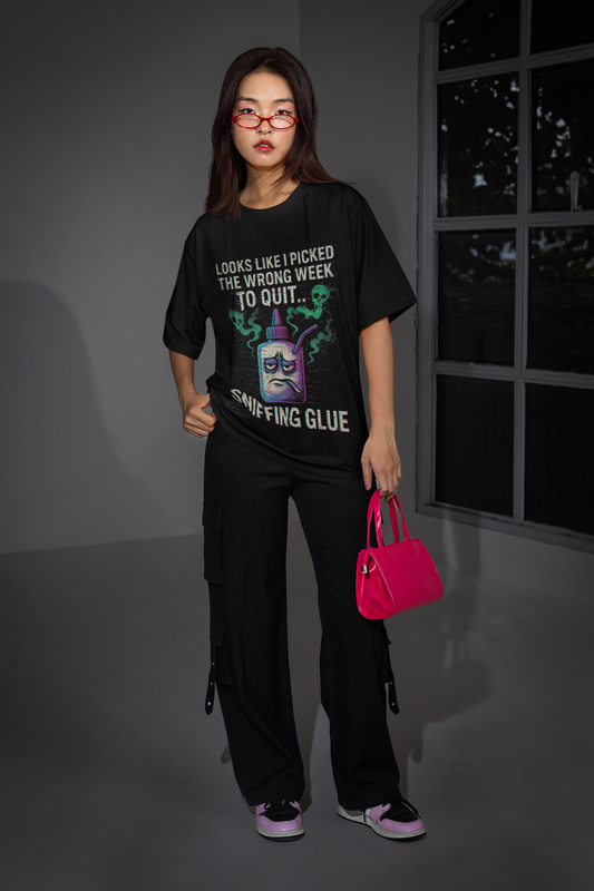 Model wearing Printify black unisex t shirt featuring sniffing glue movie quote meme unisex shirt graphic
