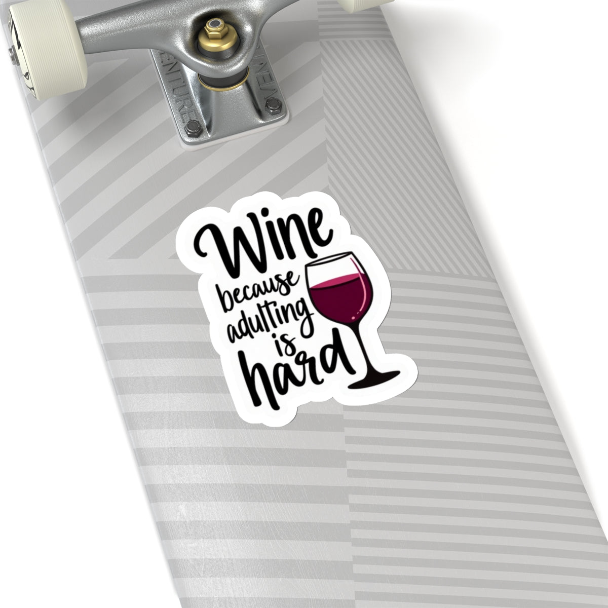 Wine because adulting is hard funny sticker with wine glass on a gray striped skateboard deck