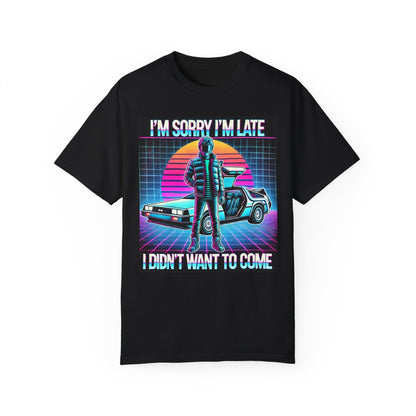 The Retro Graphic T-Shirt - Im Sorry Im Late, I Didnt Want to Come by Printify features a bold neon-style design with a figure, sports car, and sunset—perfect for pop culture fans seeking standout style.