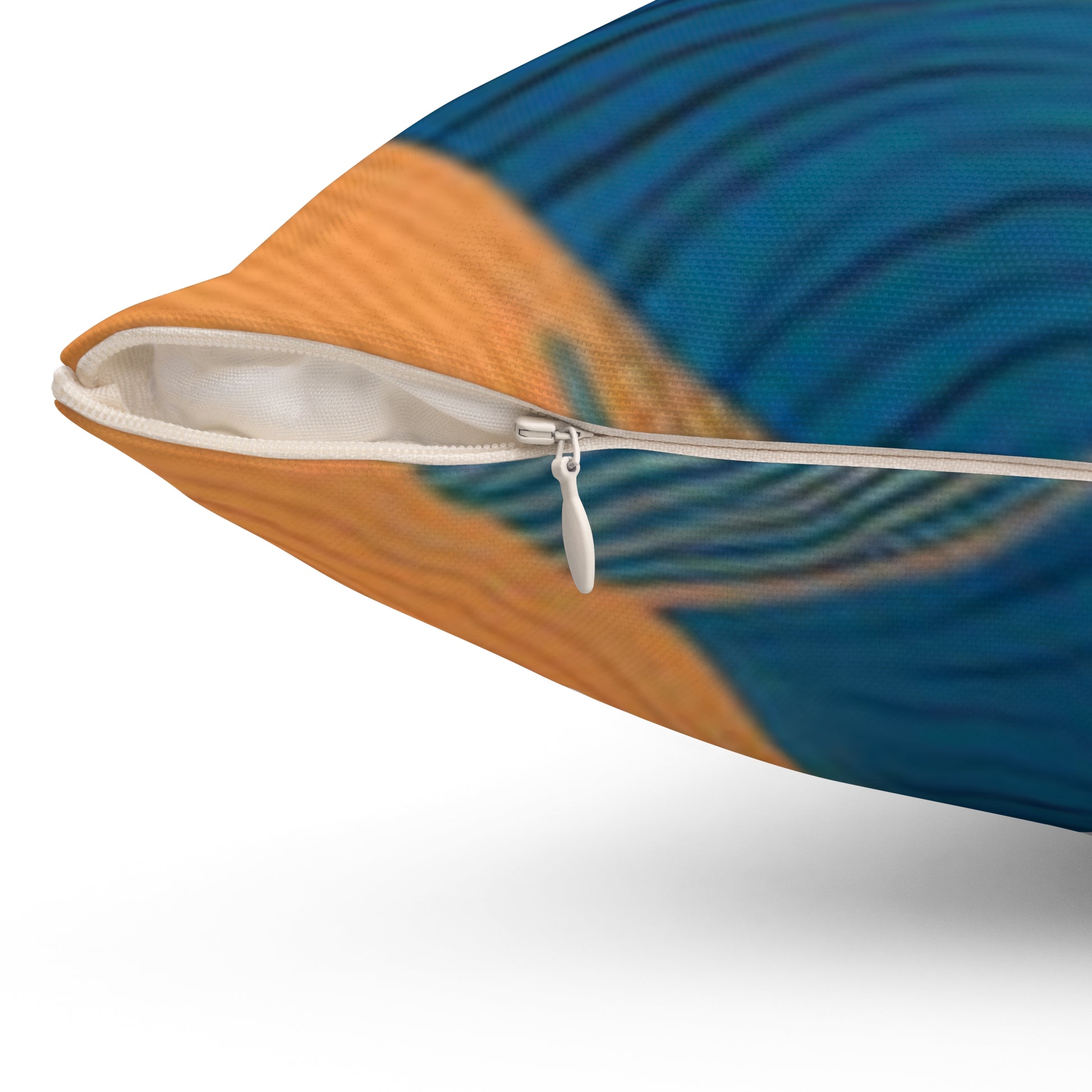 Close-up of wavy pattern throw pillow with blue and orange design showing zipper detail